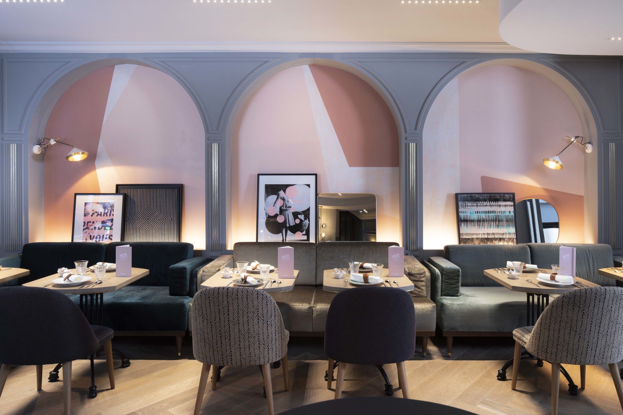 Eating area, with comfy chairs and arc designs in the walls