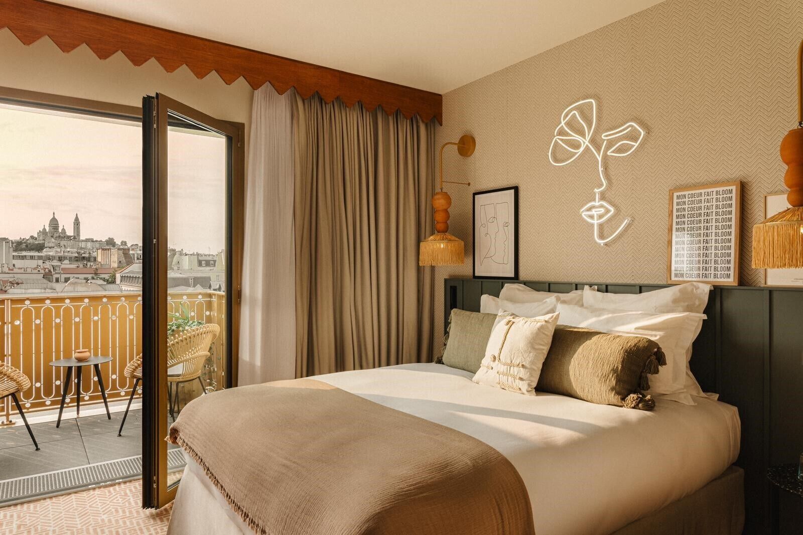 beige backround room with a double bed and balcony